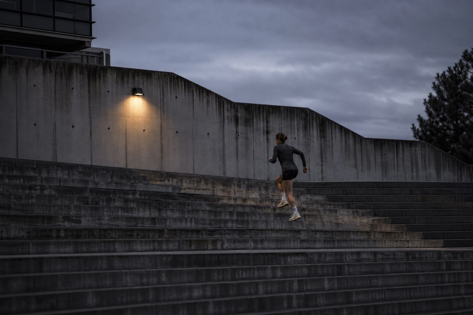 An athlete training alone before dawn